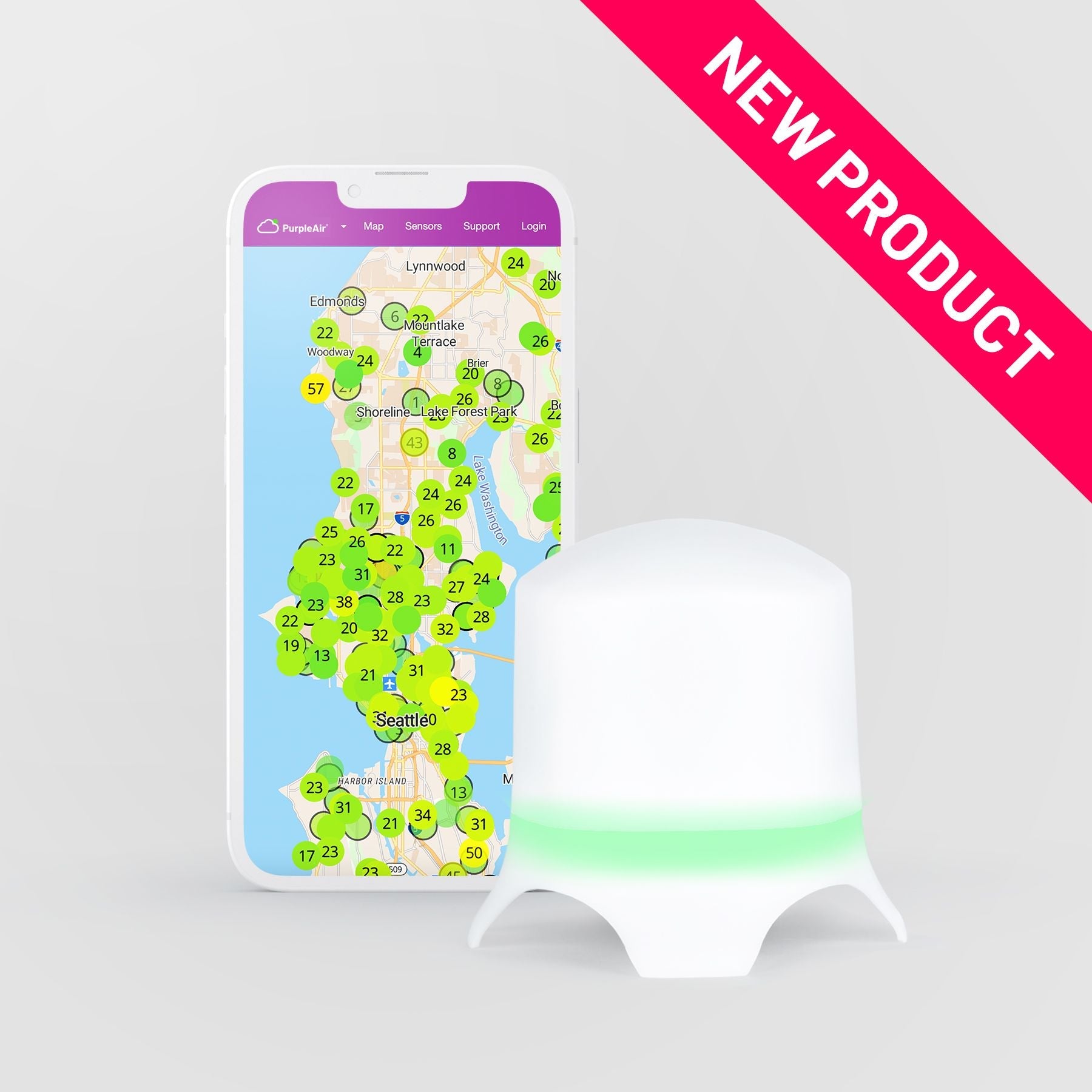 PurpleAir Zen air quality monitor with smartphone displaying air quality data on the app