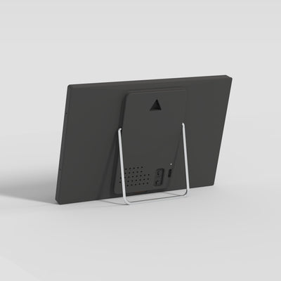 Back of the TRMNL device with stand on a light gray background