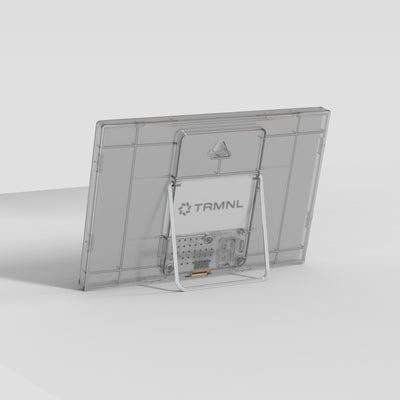 Back of the TRMNL device with stand on a light gray background