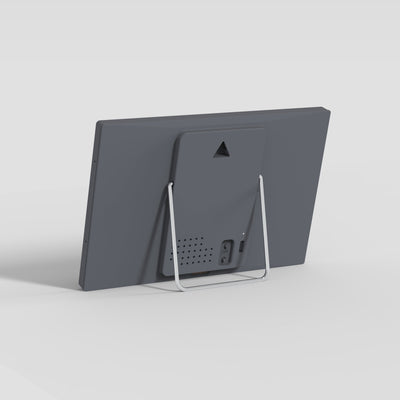 Back of the TRMNL device with stand on a light gray background