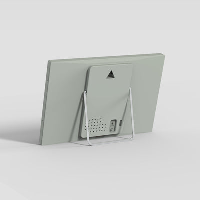 Back of the TRMNL device with stand on a light gray background