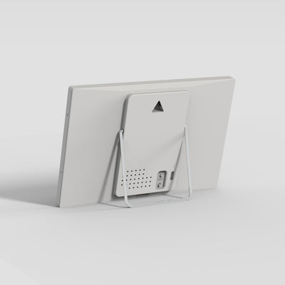 Back of the TRMNL device with stand on a light gray background