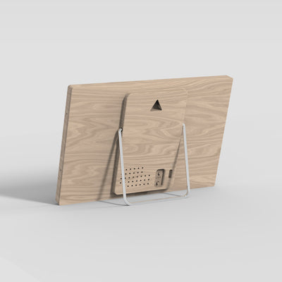 Back of the TRMNL device with stand on a light gray background